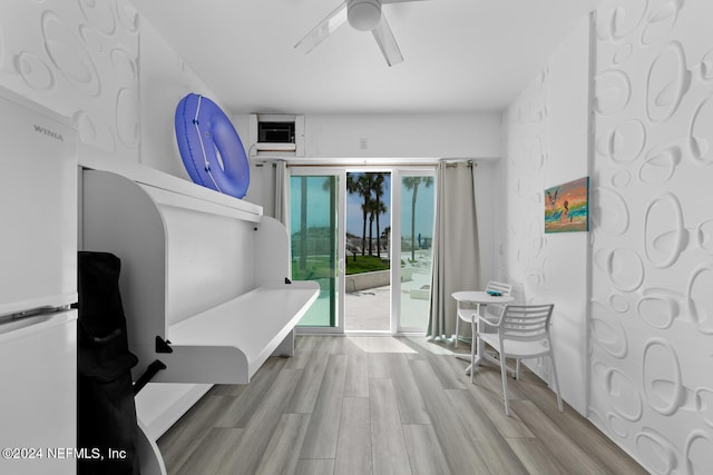 interior space featuring ceiling fan and light hardwood / wood-style flooring