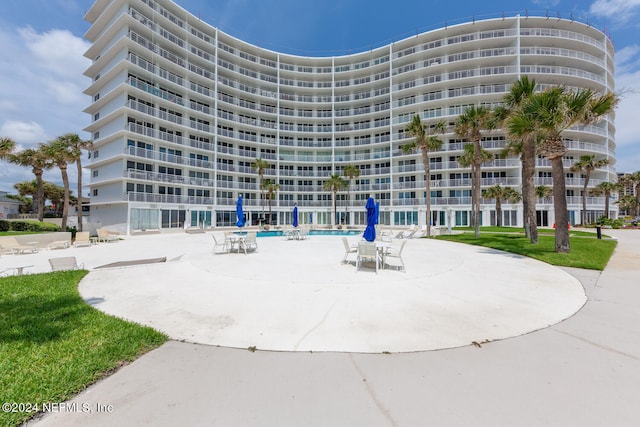 view of property featuring a community pool