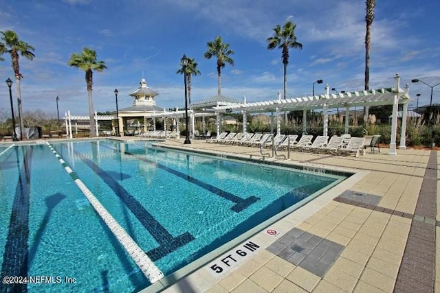 view of pool featuring a pergola and a patio area