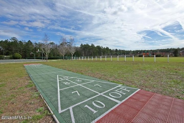 view of home's community with a lawn