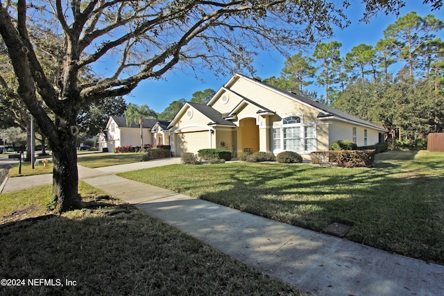 single story home with a front lawn and a garage