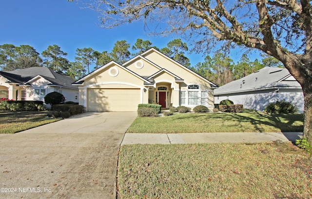 view of front of house featuring a garage and a front lawn