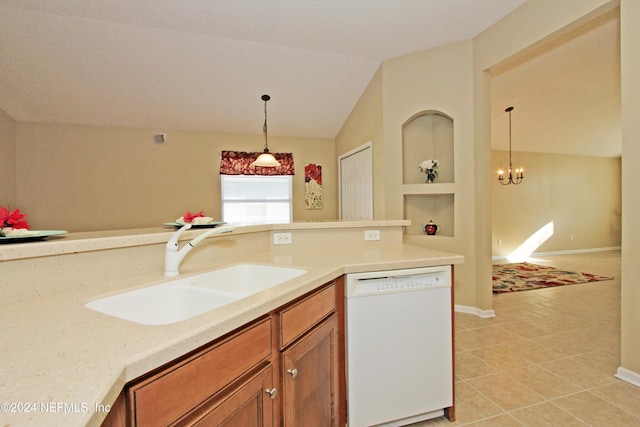 kitchen with built in shelves, sink, vaulted ceiling, dishwasher, and pendant lighting