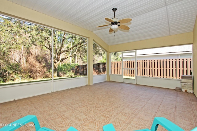 unfurnished sunroom featuring vaulted ceiling and ceiling fan