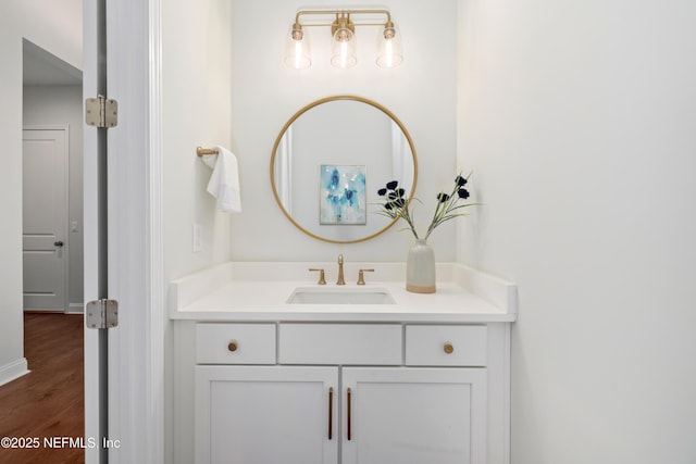 bathroom featuring vanity and hardwood / wood-style flooring