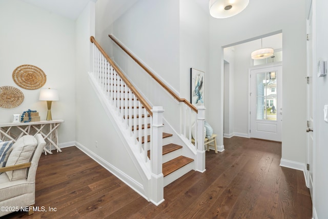 foyer entrance with dark hardwood / wood-style flooring