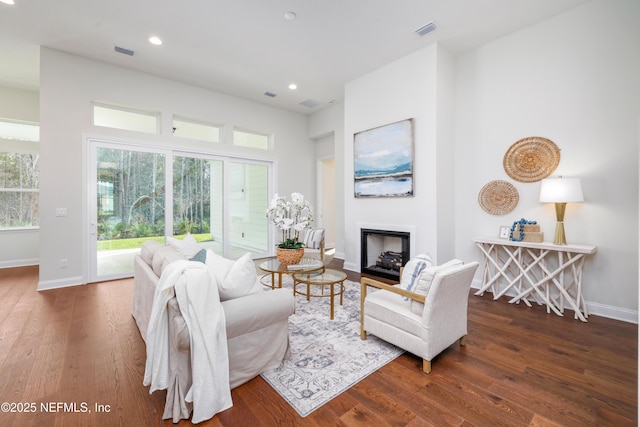 living room with dark hardwood / wood-style floors