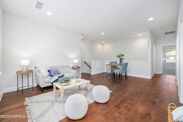 living room featuring dark wood-type flooring