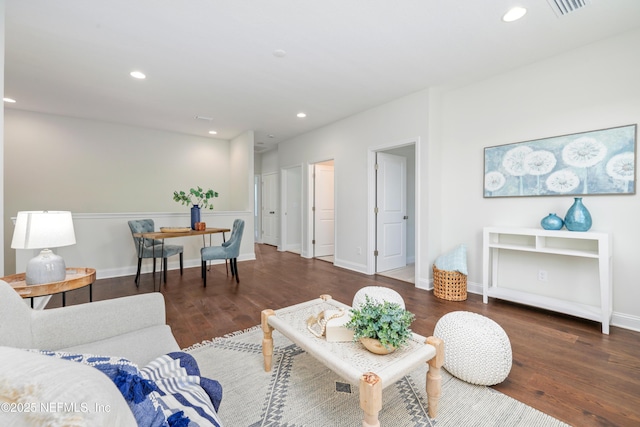 living room with dark hardwood / wood-style flooring