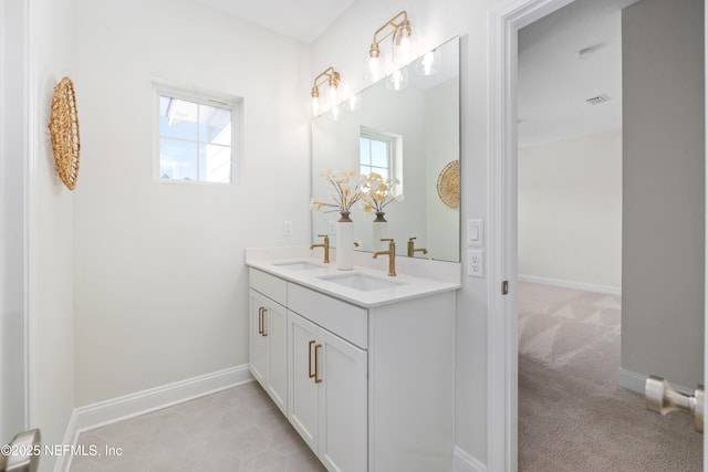 bathroom with tile patterned floors and vanity