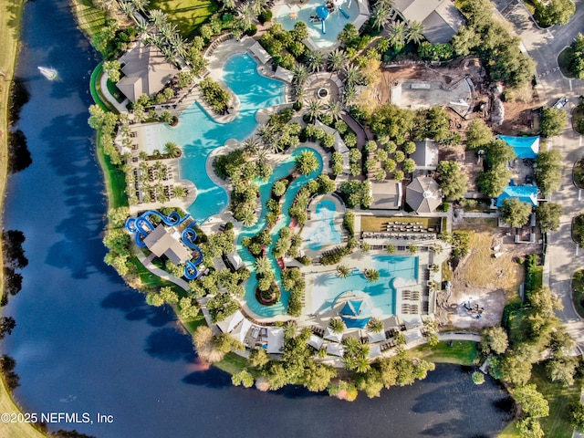 birds eye view of property with a water view