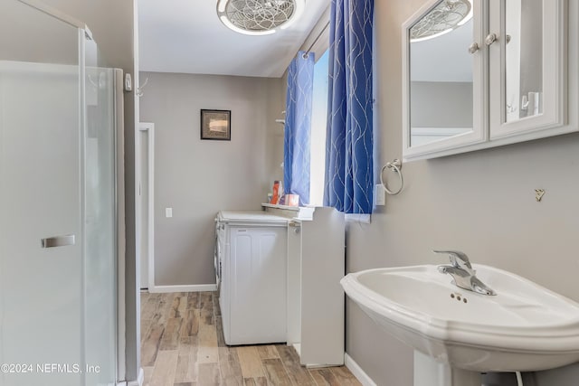 bathroom with wood-type flooring and sink