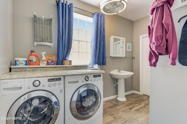 laundry area with washer and clothes dryer and sink