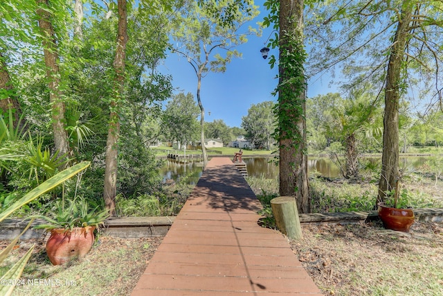 surrounding community featuring a water view