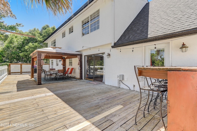 wooden deck with a gazebo