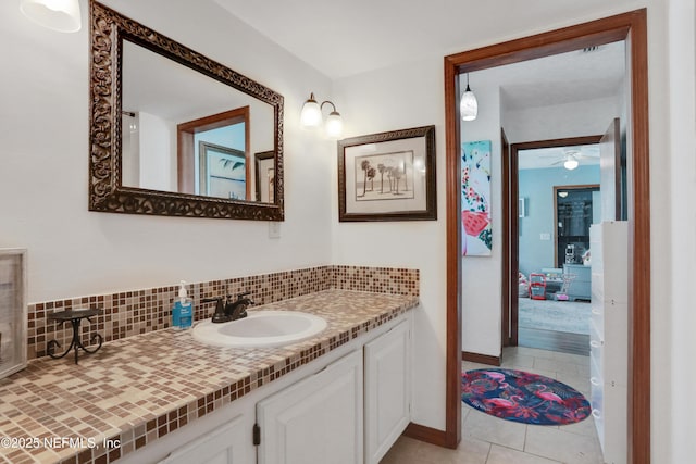 bathroom with vanity, tasteful backsplash, tile patterned floors, and ceiling fan