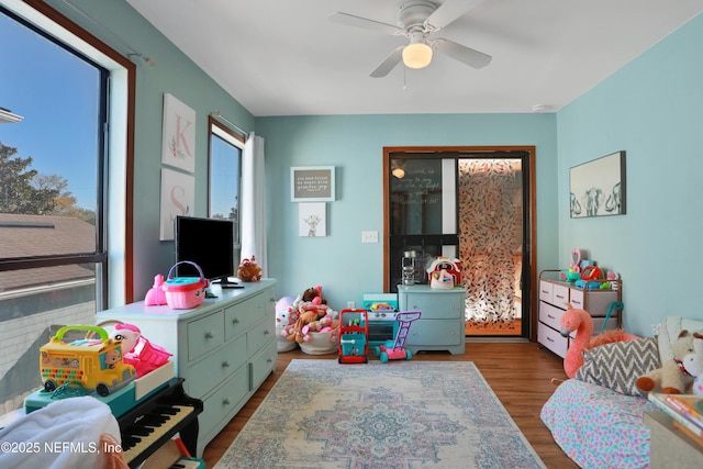 bedroom with light hardwood / wood-style flooring and ceiling fan