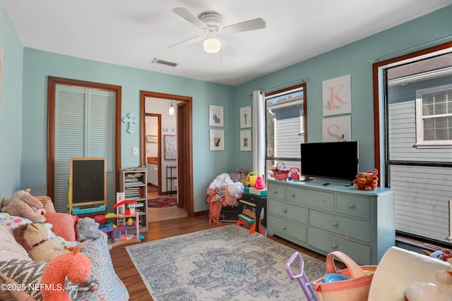 game room featuring hardwood / wood-style flooring and ceiling fan