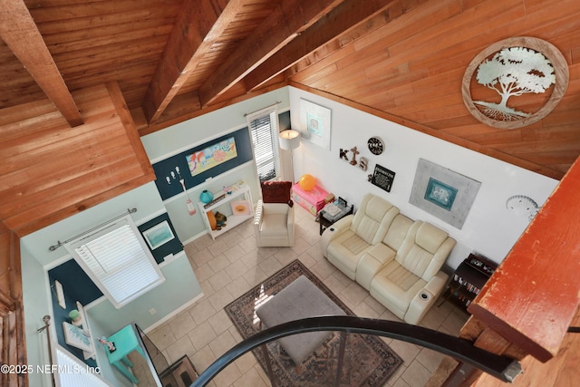 living room with a healthy amount of sunlight, tile patterned floors, and wooden ceiling