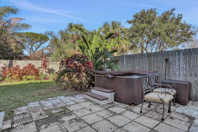 view of patio / terrace featuring a hot tub