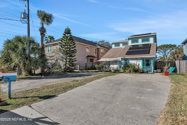 view of front of house featuring solar panels