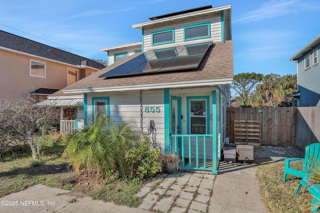 view of front of property with solar panels