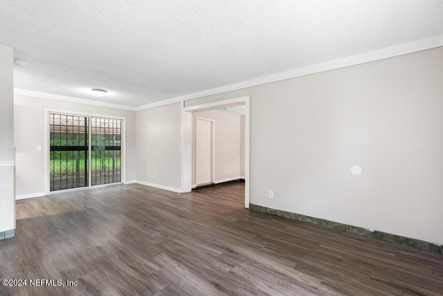 empty room with a textured ceiling, dark hardwood / wood-style floors, and crown molding