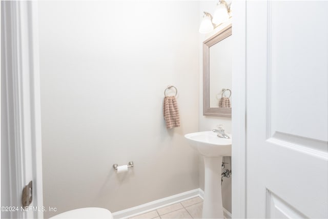 bathroom with tile patterned floors