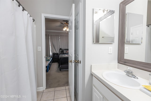 bathroom featuring tile patterned floors, ceiling fan, and vanity