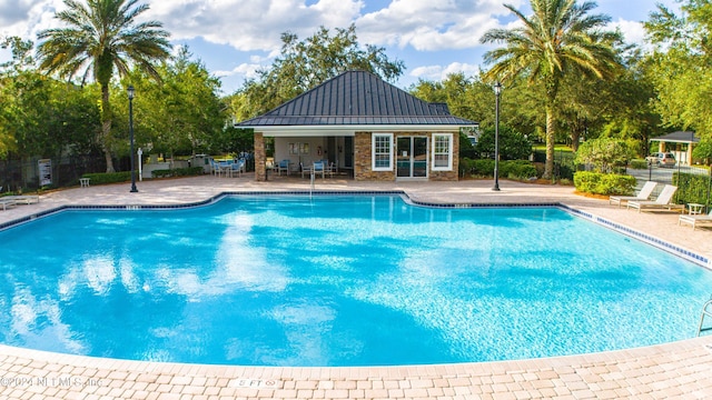 view of swimming pool with a patio