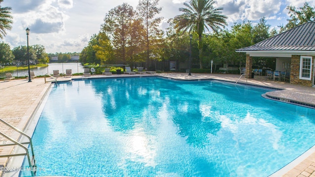 view of swimming pool with a patio area