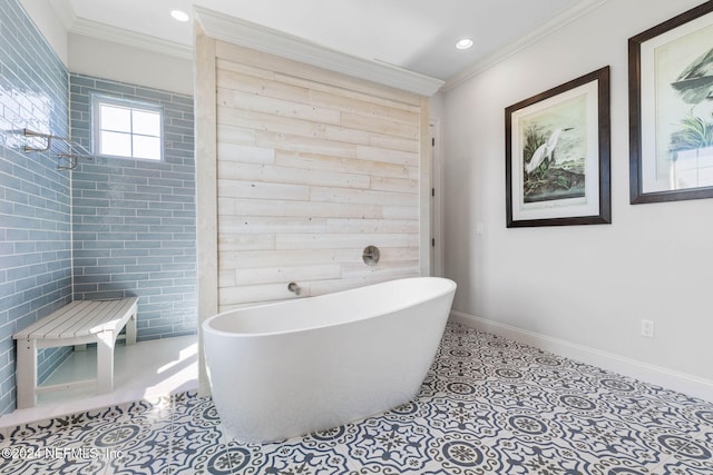 bathroom with ornamental molding and a tub to relax in