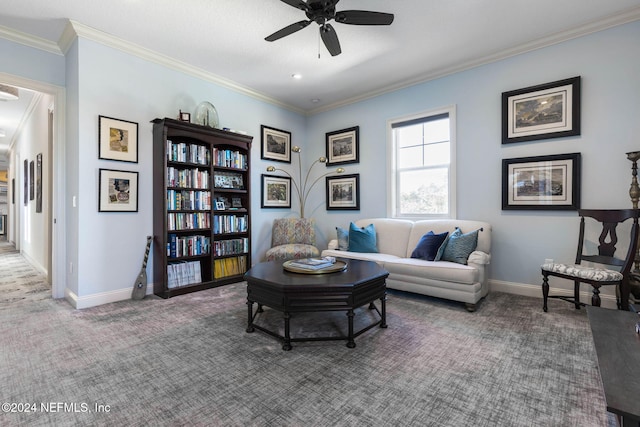 living room featuring carpet, ceiling fan, and crown molding