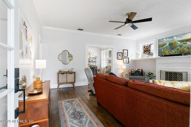 living room with ceiling fan, crown molding, and dark hardwood / wood-style floors