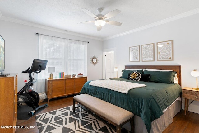 bedroom featuring a textured ceiling, dark hardwood / wood-style floors, ceiling fan, and ornamental molding