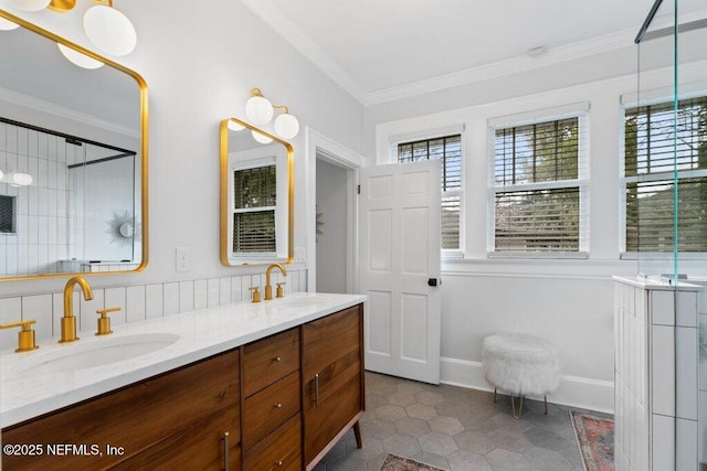 bathroom featuring tile patterned floors, a wealth of natural light, crown molding, and vanity