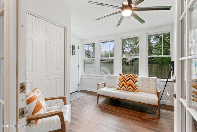 sunroom / solarium featuring ceiling fan and vaulted ceiling