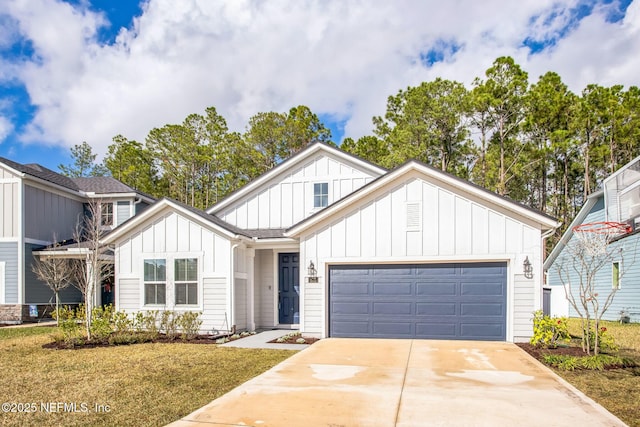 view of front of property featuring a garage and a front lawn