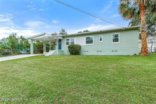 back of house with a lawn