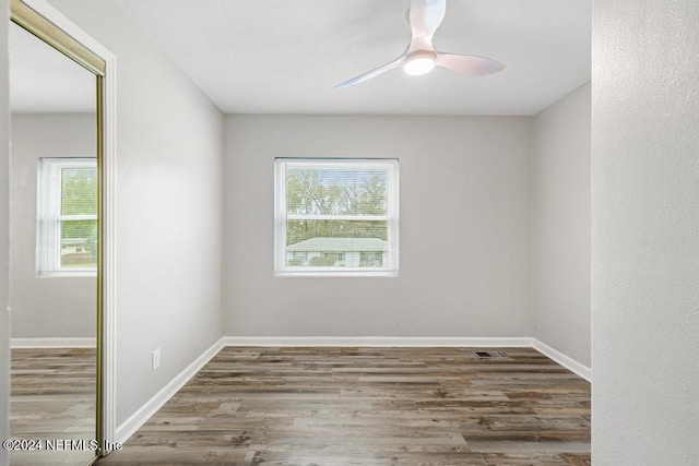 unfurnished room featuring ceiling fan and wood-type flooring