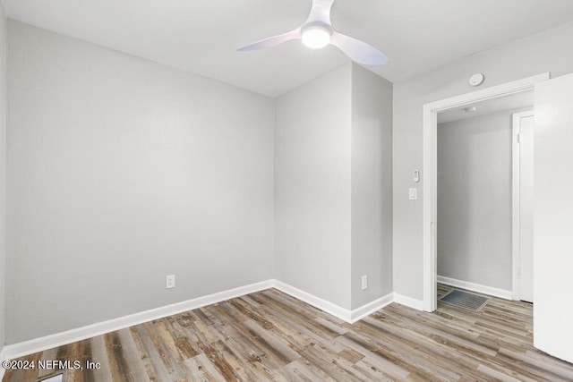 empty room featuring light hardwood / wood-style flooring and ceiling fan