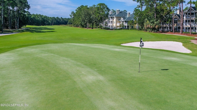 view of property's community with a lawn