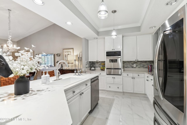 kitchen featuring white cabinetry, sink, and appliances with stainless steel finishes