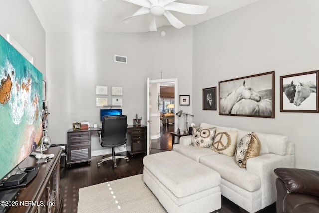 office space with ceiling fan, dark hardwood / wood-style floors, and high vaulted ceiling