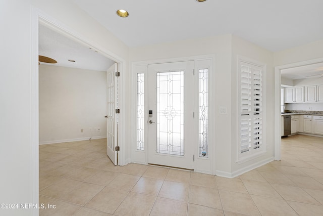 view of tiled foyer entrance