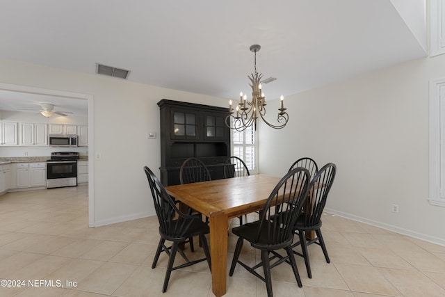 dining area with ceiling fan with notable chandelier and light tile patterned flooring