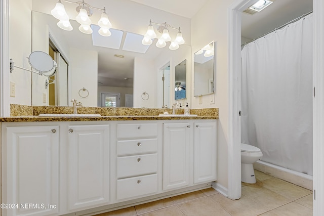 bathroom with tile patterned floors, vanity, toilet, and a shower with curtain