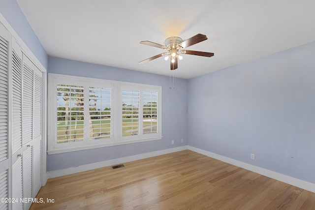 empty room featuring ceiling fan and light wood-type flooring