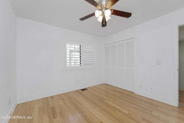 unfurnished bedroom with a closet, ceiling fan, and light hardwood / wood-style flooring