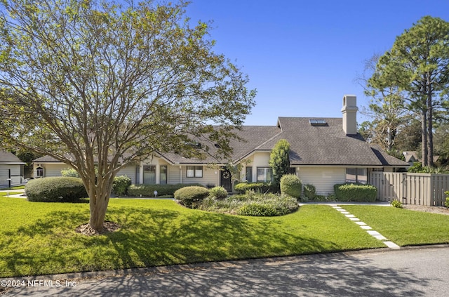 cape cod-style house with a front lawn